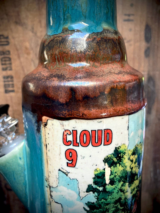 Handmade Ceramic Bong Cloud 9 Cozy Floating Home blue and brown glazed ceramic bong close up with Cloud 9 label and tree art