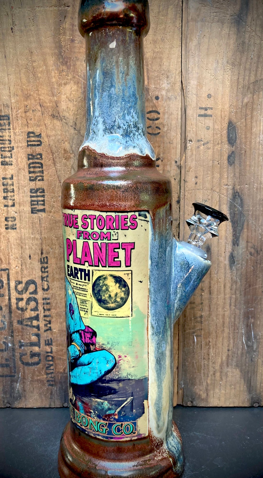 True Stories from Planet Earth Ceramic Bong hand glazed tall bottle style with vintage planet label by Berkshire Bong Co