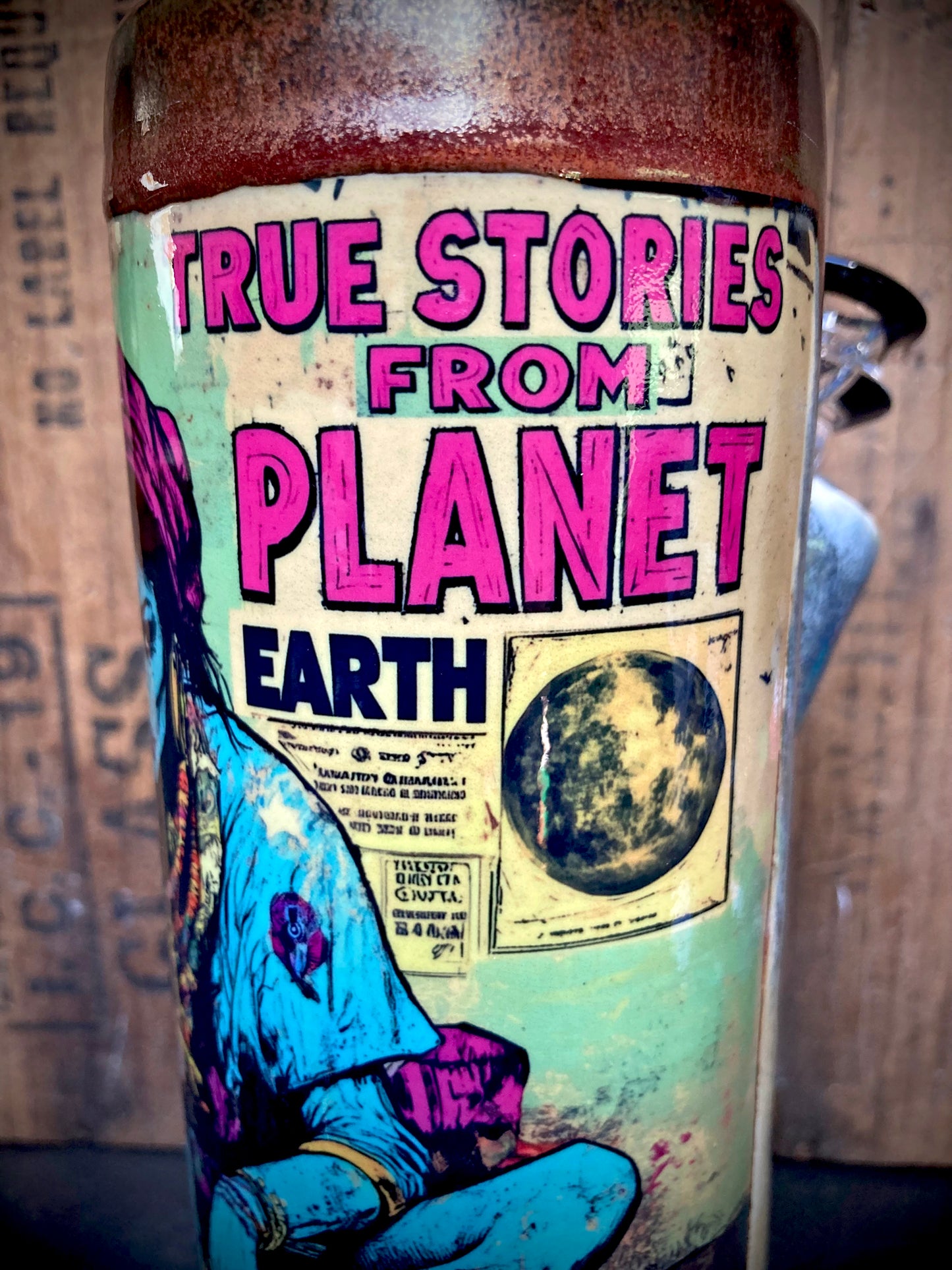 True Stories from Planet Earth Ceramic Bong with colorful comic style artwork and glazed finish
