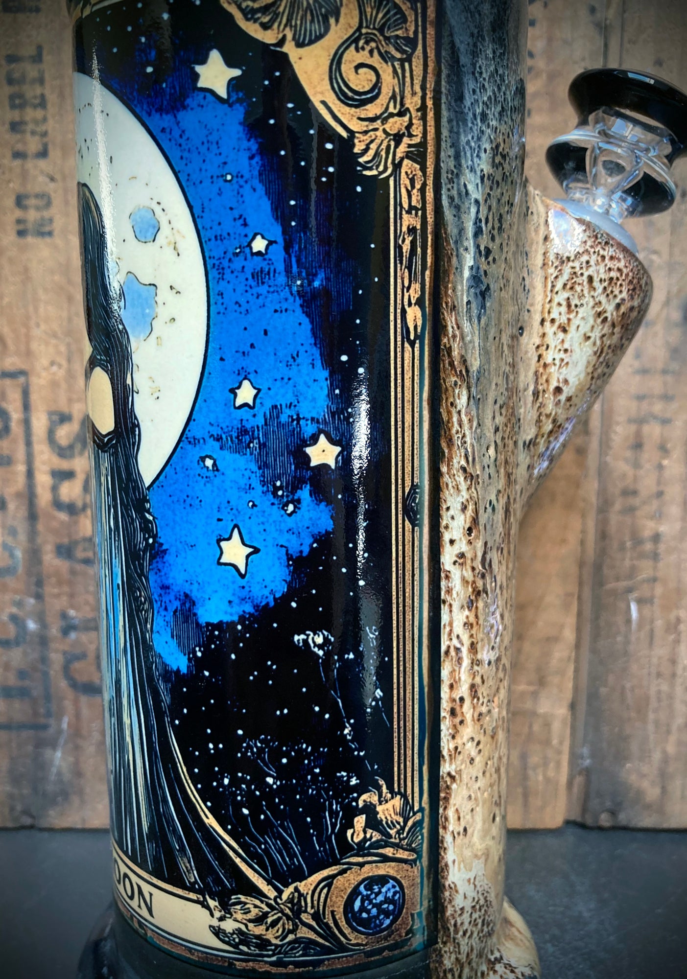 Ceramic bong with deep blue night sky, golden stars, and detailed full moon art.