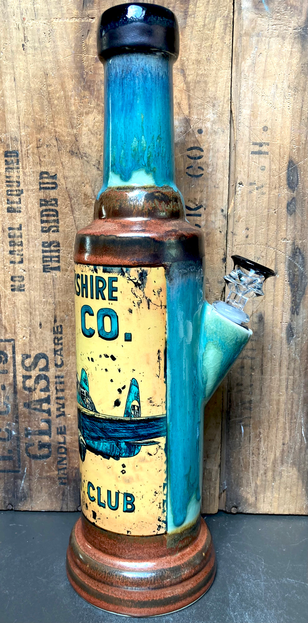 Base of bong with metallic antique copper glaze and smooth transitions to turquoise.