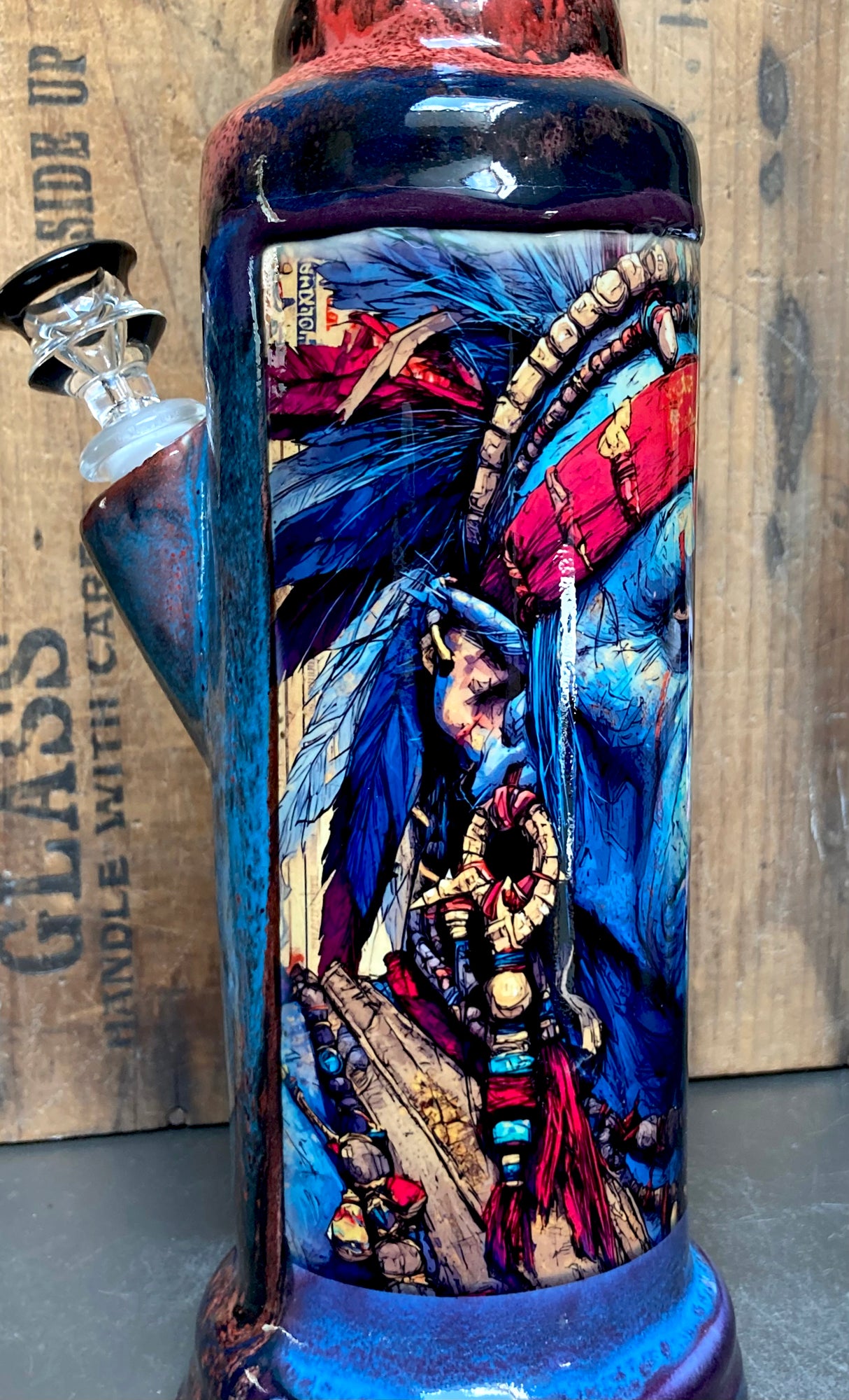 Chief Savage Ceramic Bong Wild Blue Warrior ceramic bong with blue glaze detailed warrior artwork and glass downstem and bowl