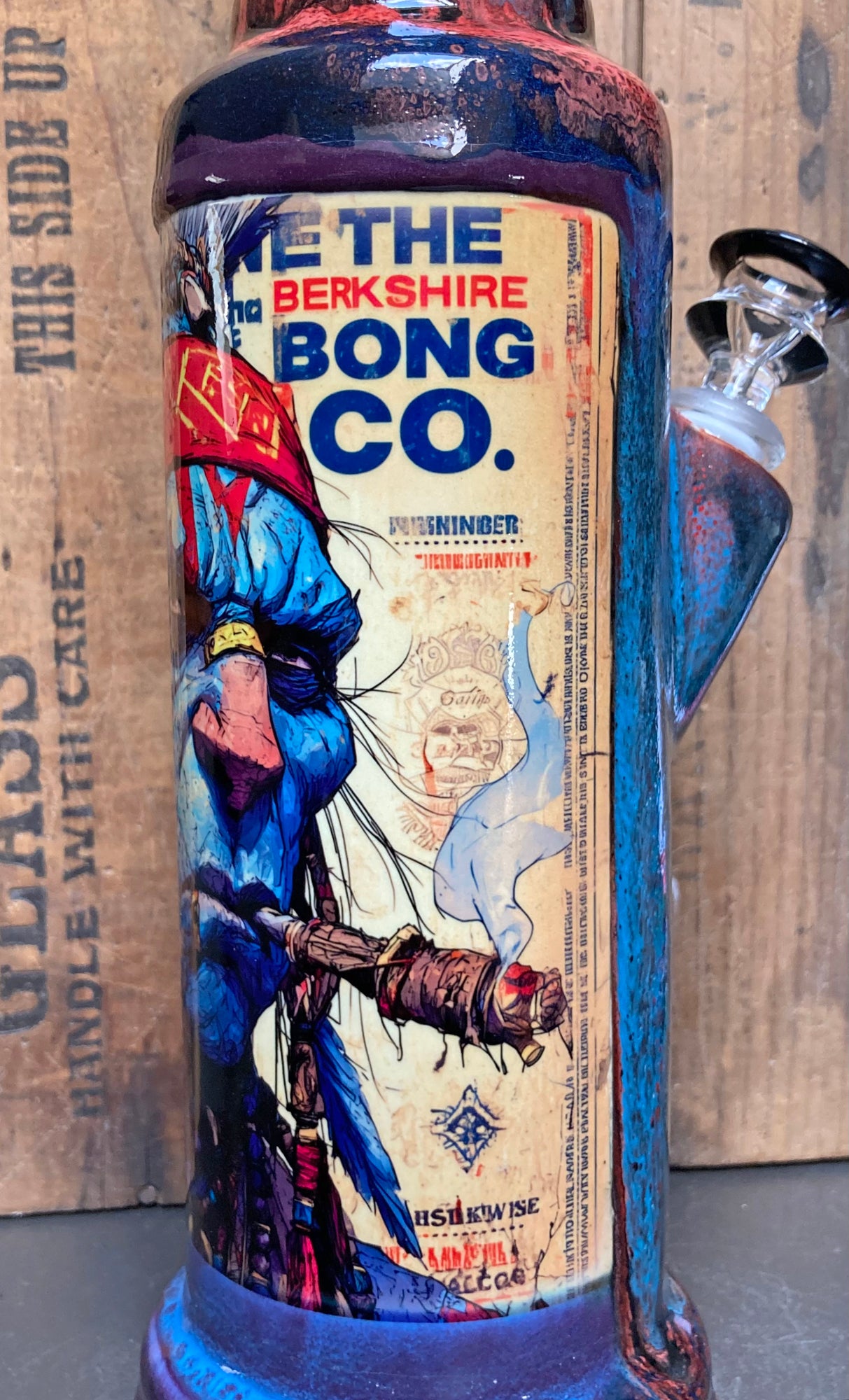 Side angle of the Savage Chief bong showing rich glossy glazes and detailed artwork.
