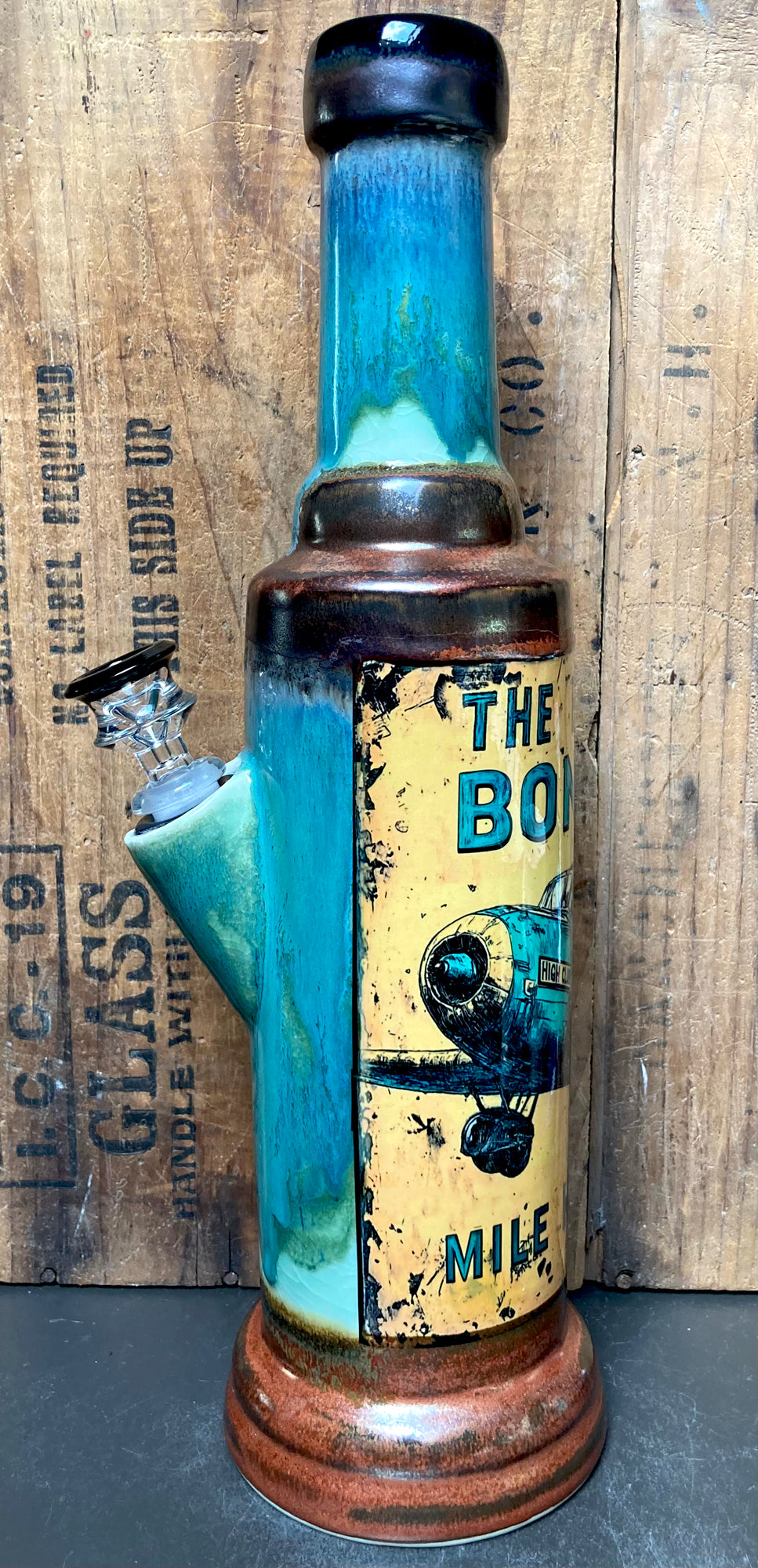 Close-up of airplane illustration with distressed paint effect and High Club banner.