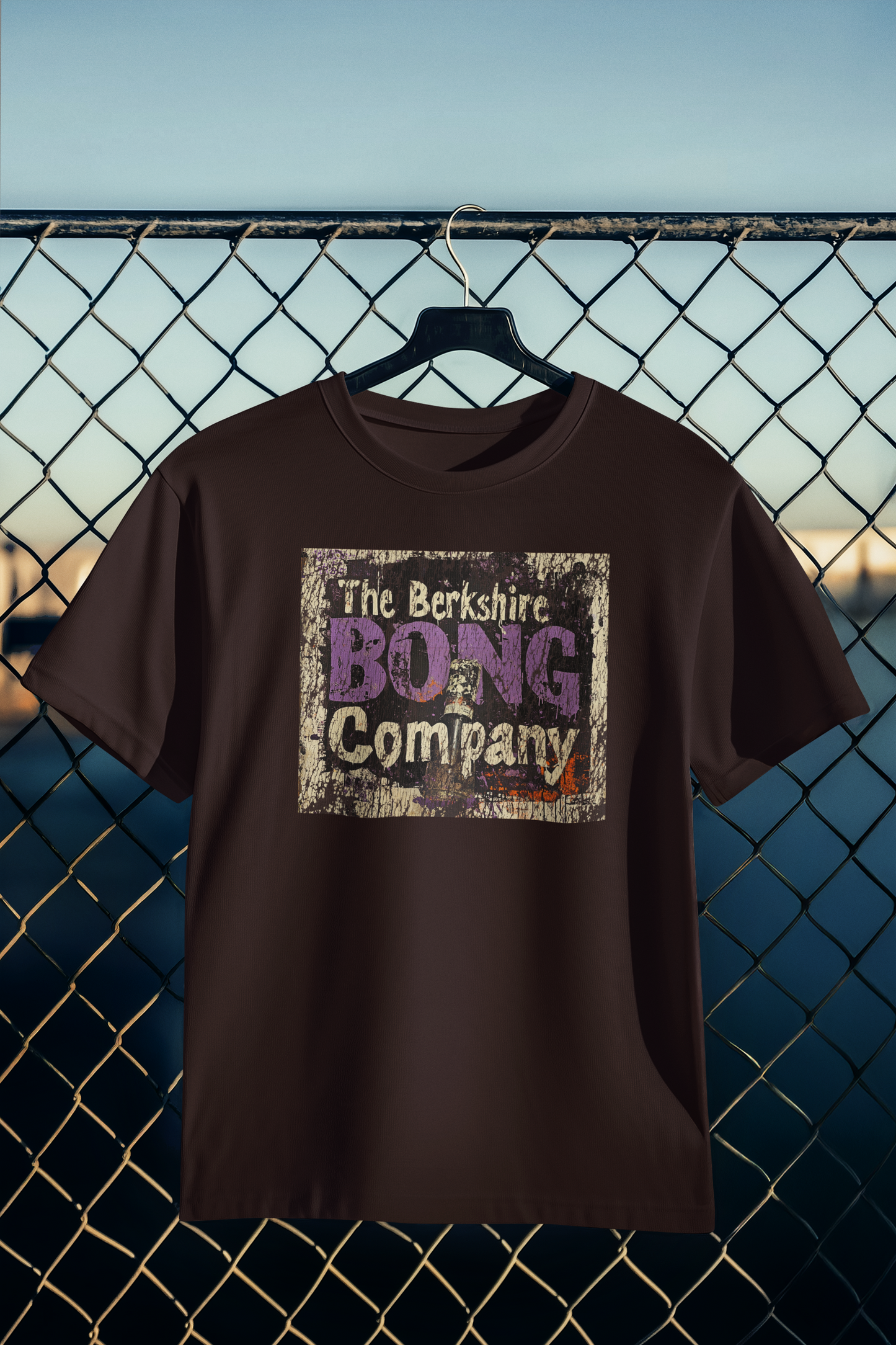 Distressed Graffiti Logo T-Shirt Vintage Street Art Style Tee in Dark Brown. with Berkshire Bong Company logo on hanger