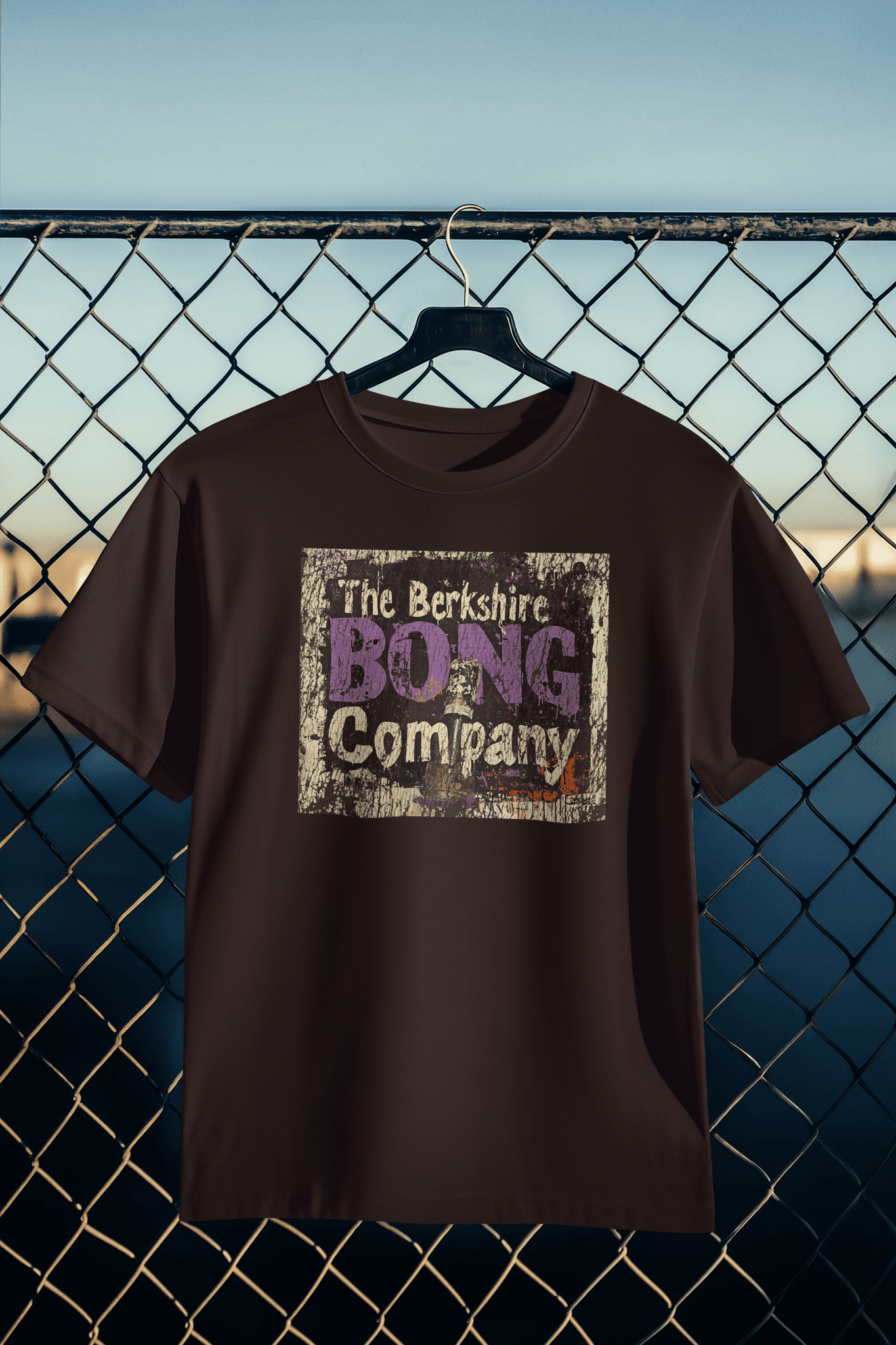 Distressed Graffiti Logo T-Shirt Vintage Street Art Style Tee in Dark Brown. with Berkshire Bong Company logo on hanger
