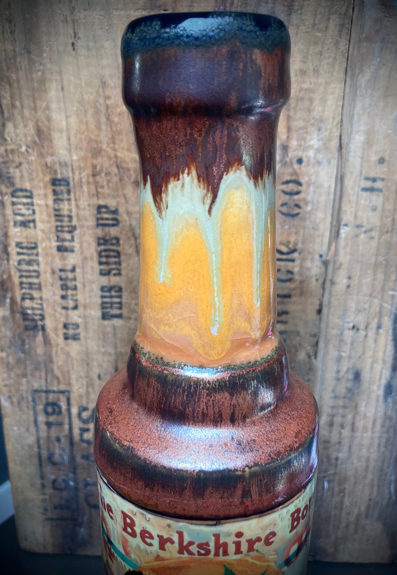 Handmade Ceramic Bong Chimp with Tongue Out Bright Orange Antiqued Copper Glaze. Ceramic neck closeup with Berkshire label