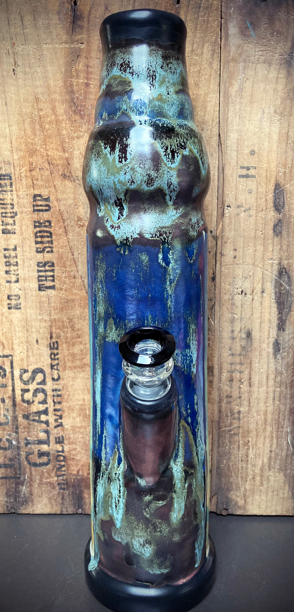 Handcrafted bong with star seed warrior and cosmic blue silver glaze.