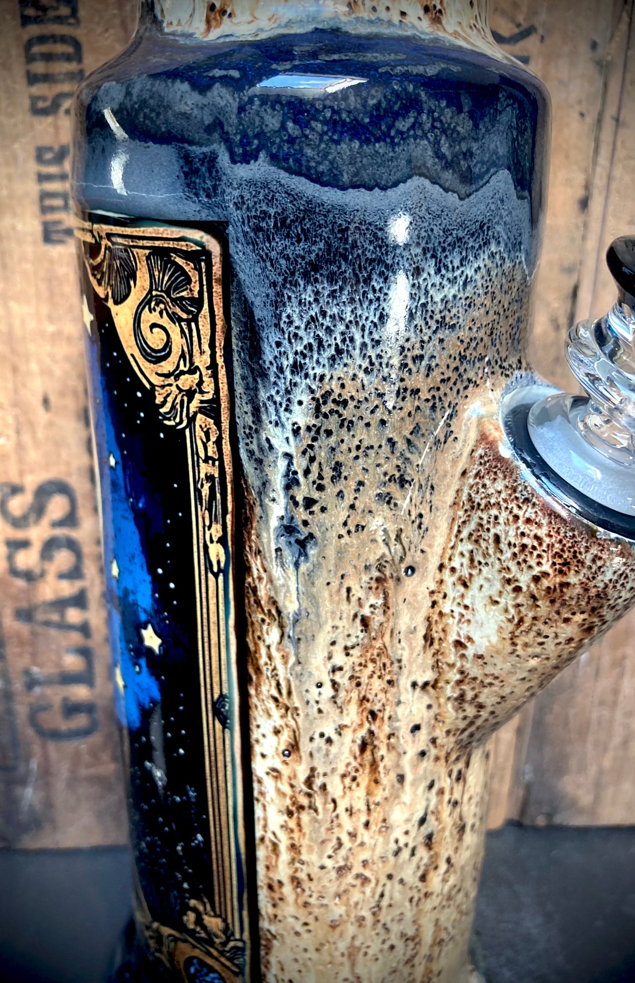 Side view showing pitted, crater-like glaze texture and melting glaze transitions.