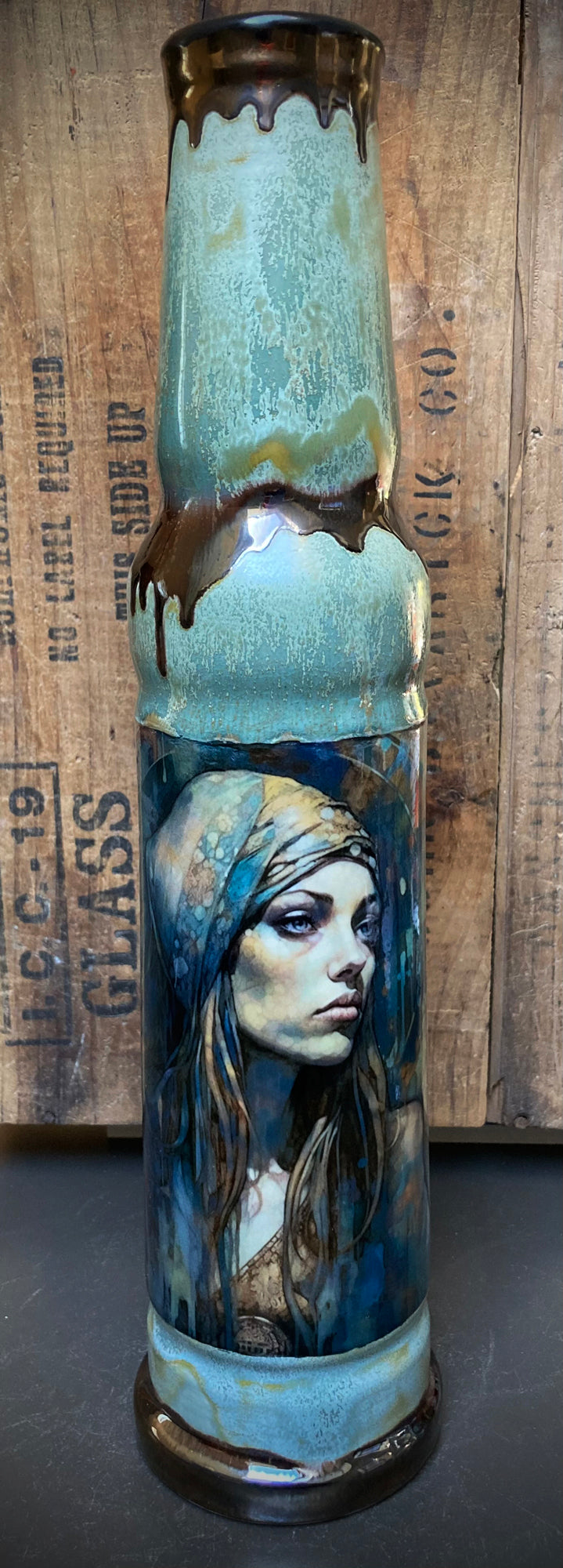 River Queen artwork on handmade ceramic bong with soft glazes.