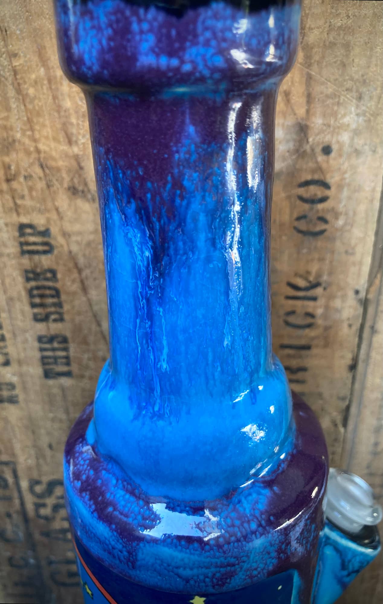 Ceramic Care Bear Bong with a vibrant blue and purple finish for unique smoking experience