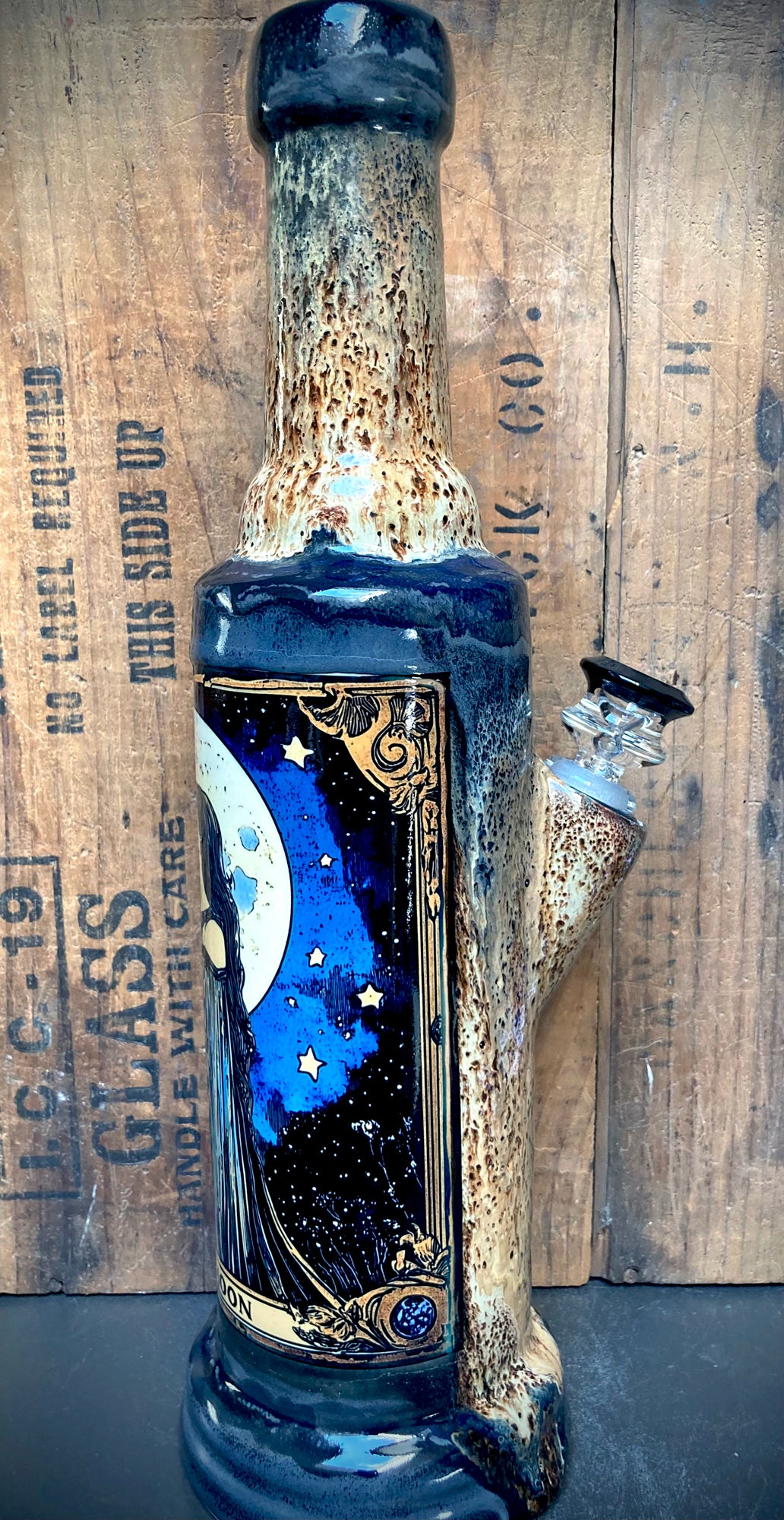 Detailed view of ornate scroll border and rich, earthy glaze patterns.