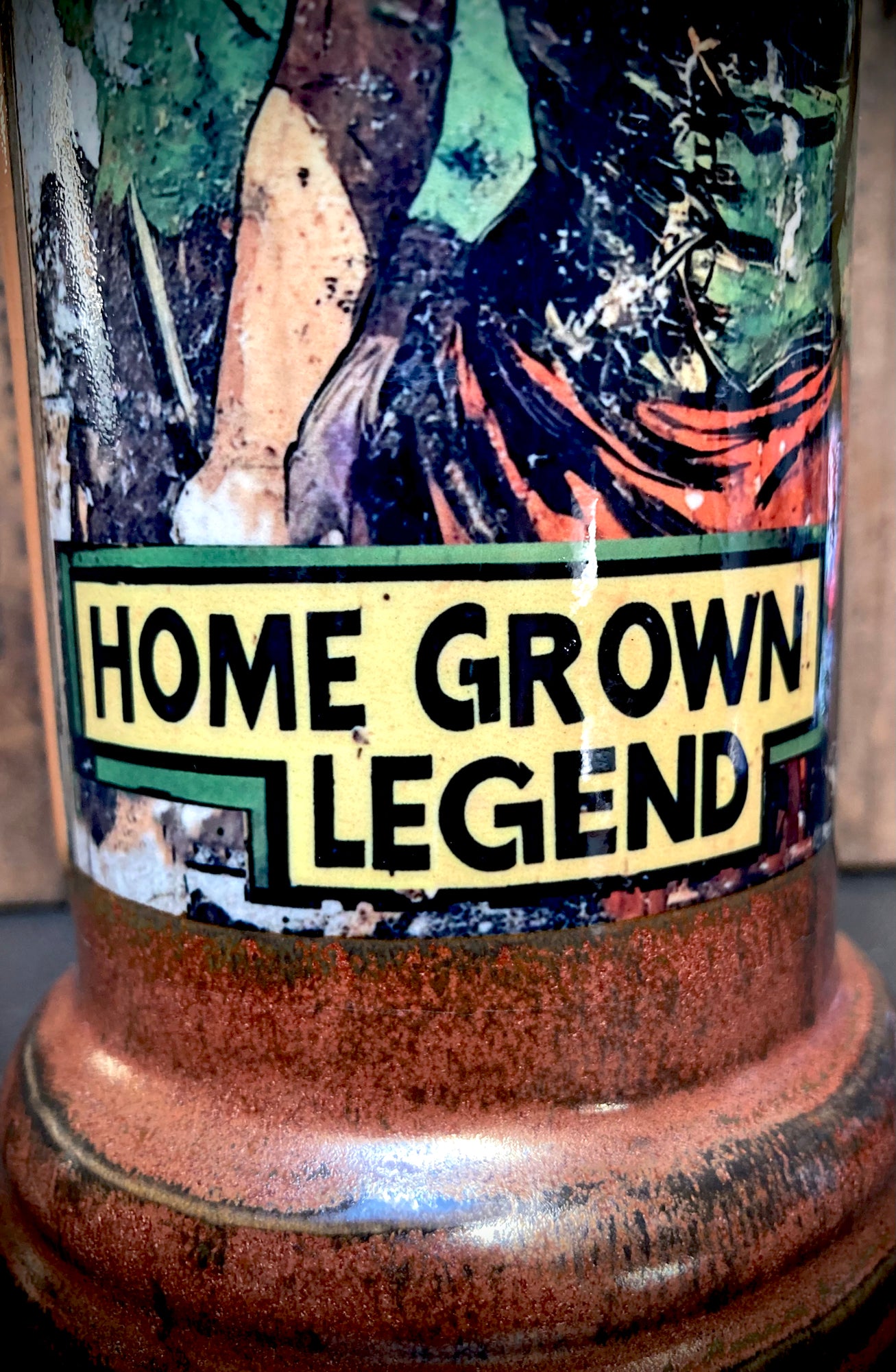 Unique handmade bong with vintage pinup artwork and vibrant orange glaze.