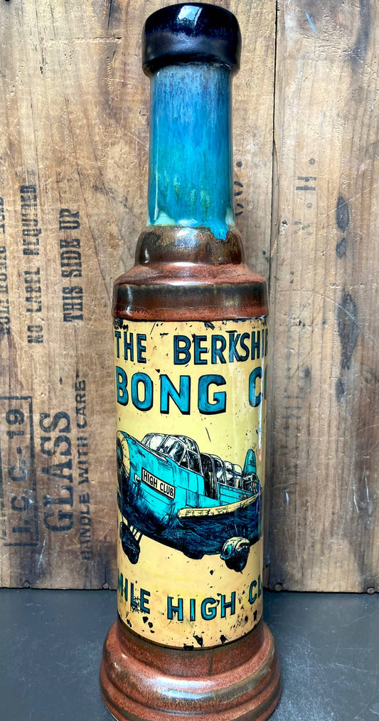 Side angle highlighting glossy glaze colors melting into each other and bold artwork.