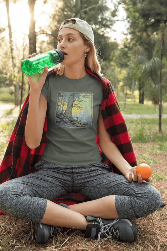 Vintage military green shirt with glowing sunrise clearing and tree illustration