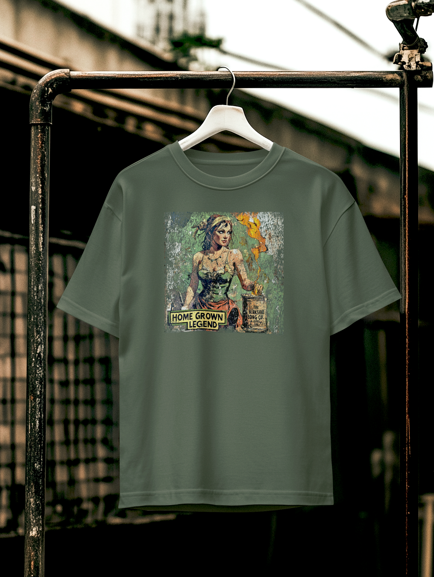 Heavily cracked military green shirt featuring Homegrown Legend art and retro text