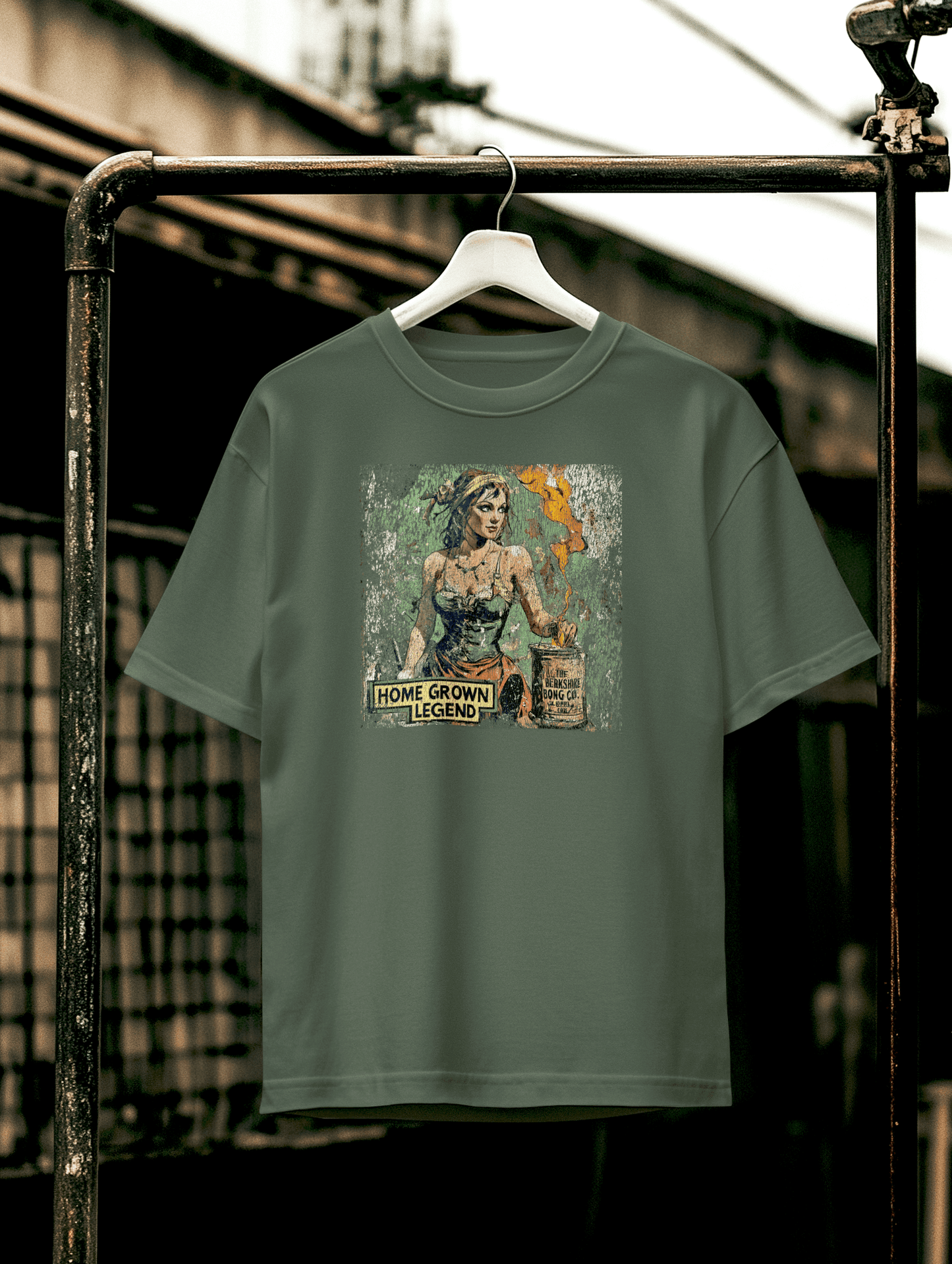 Heavily cracked military green shirt featuring Homegrown Legend art and retro text