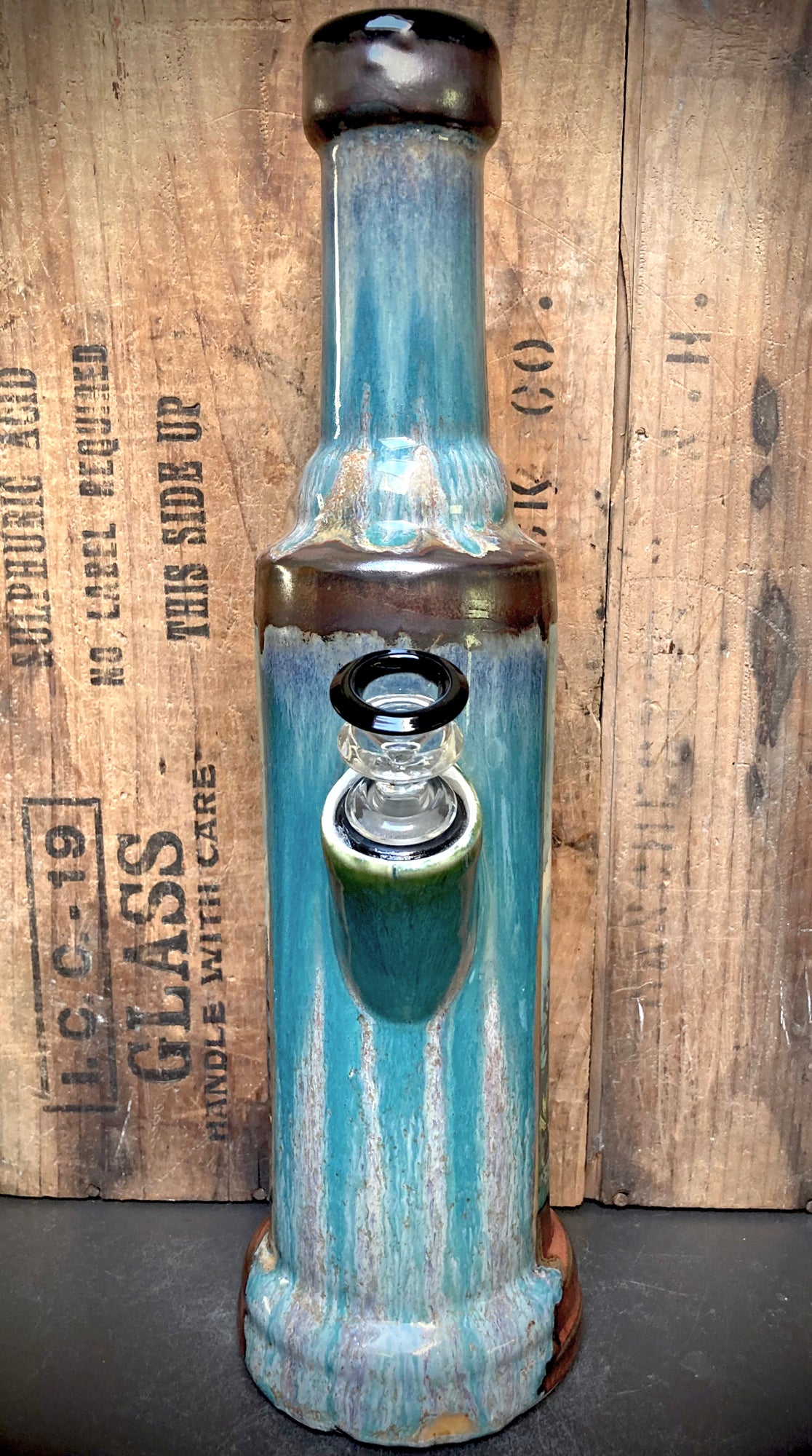 Side view highlighting glaze transitions from turquoise to antique copper.