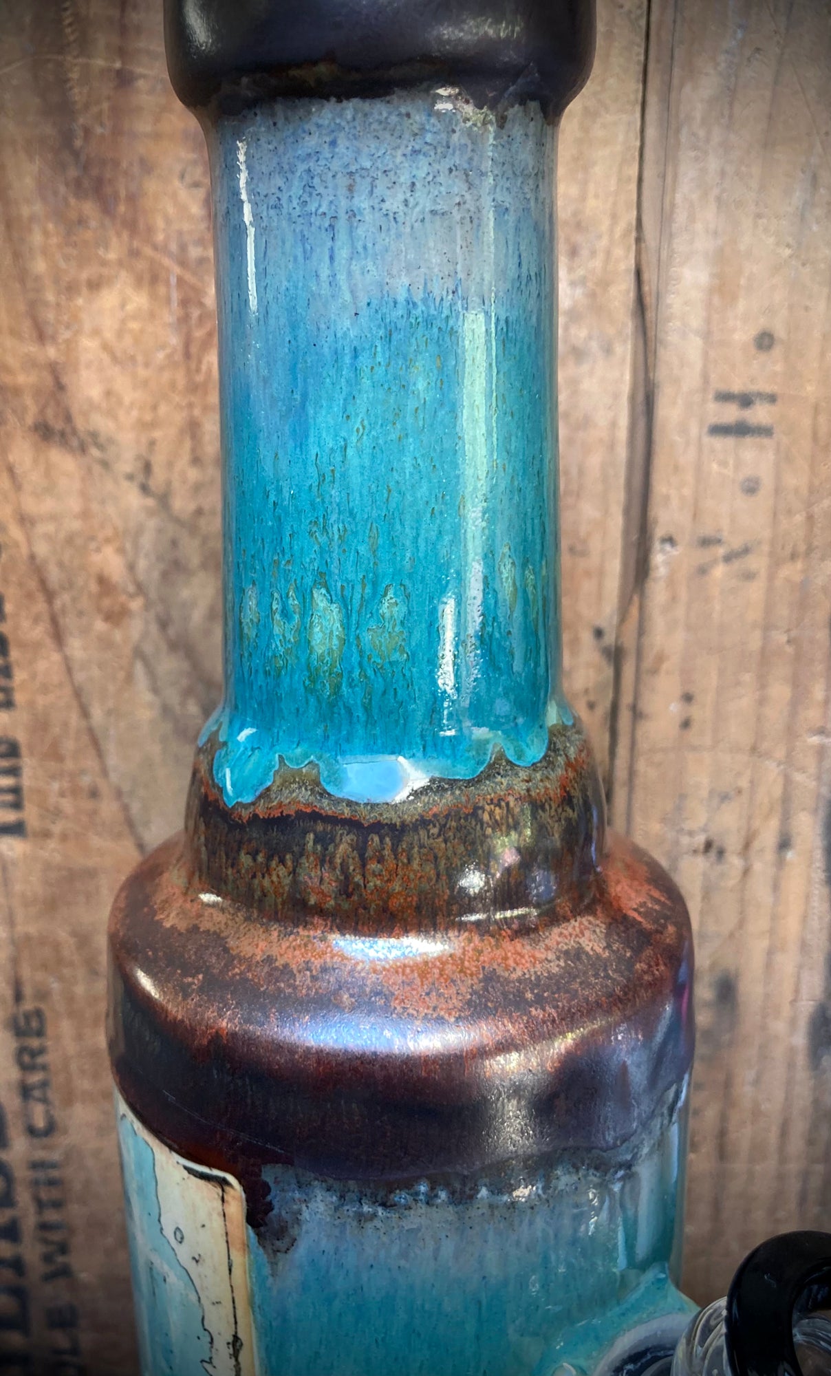 earthy clay ceramic bong with sky blue glaze and copper collar