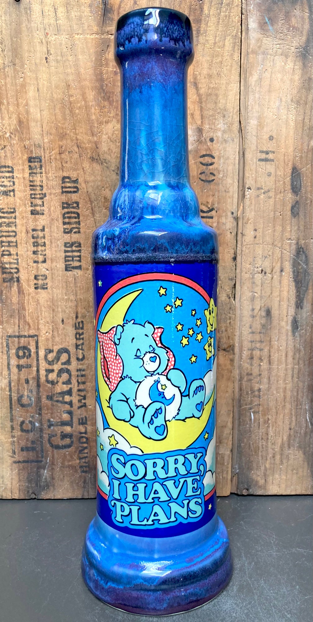 Blue bottle shaped Handmade Ceramic Bong Cute Care Bear Moon Art featuring Care Bear on moon and Sorry I Have Plans text