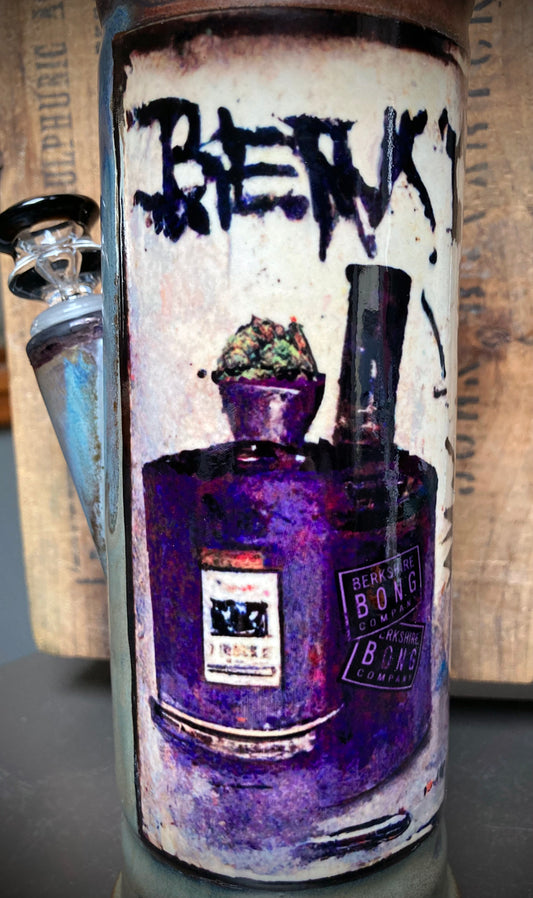 Handmade bong featuring a cartoon critter and urban graffiti in grey-green tones.