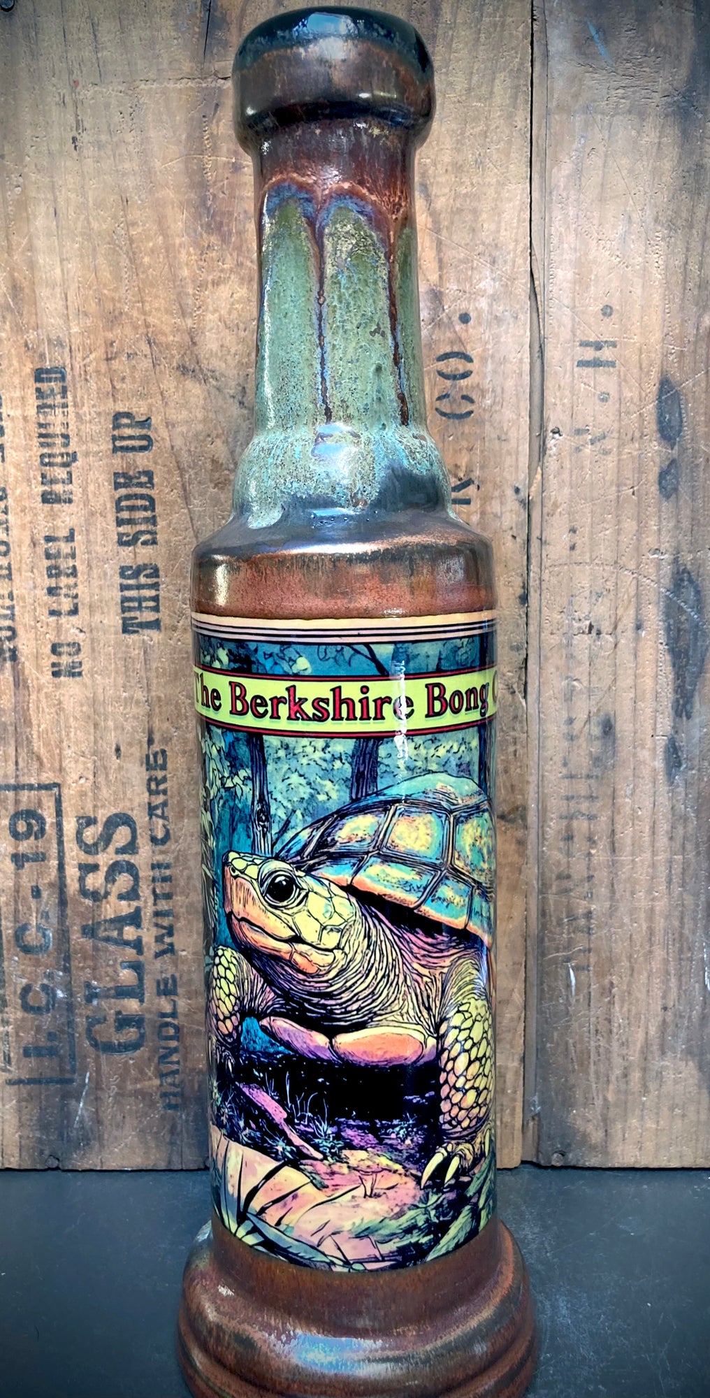 Handmade ceramic bong with moss-green and ancient copper glazes