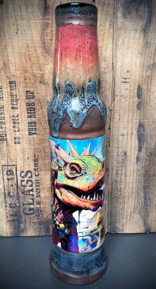 Jungle-themed bong with dinosaurs and fiery red-orange-green glaze mix.