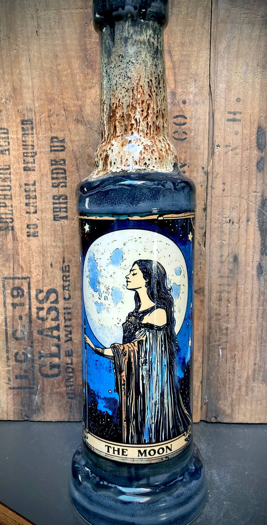 Handmade ceramic bong with wildly detailed glossy black, grey, and brown glazes.