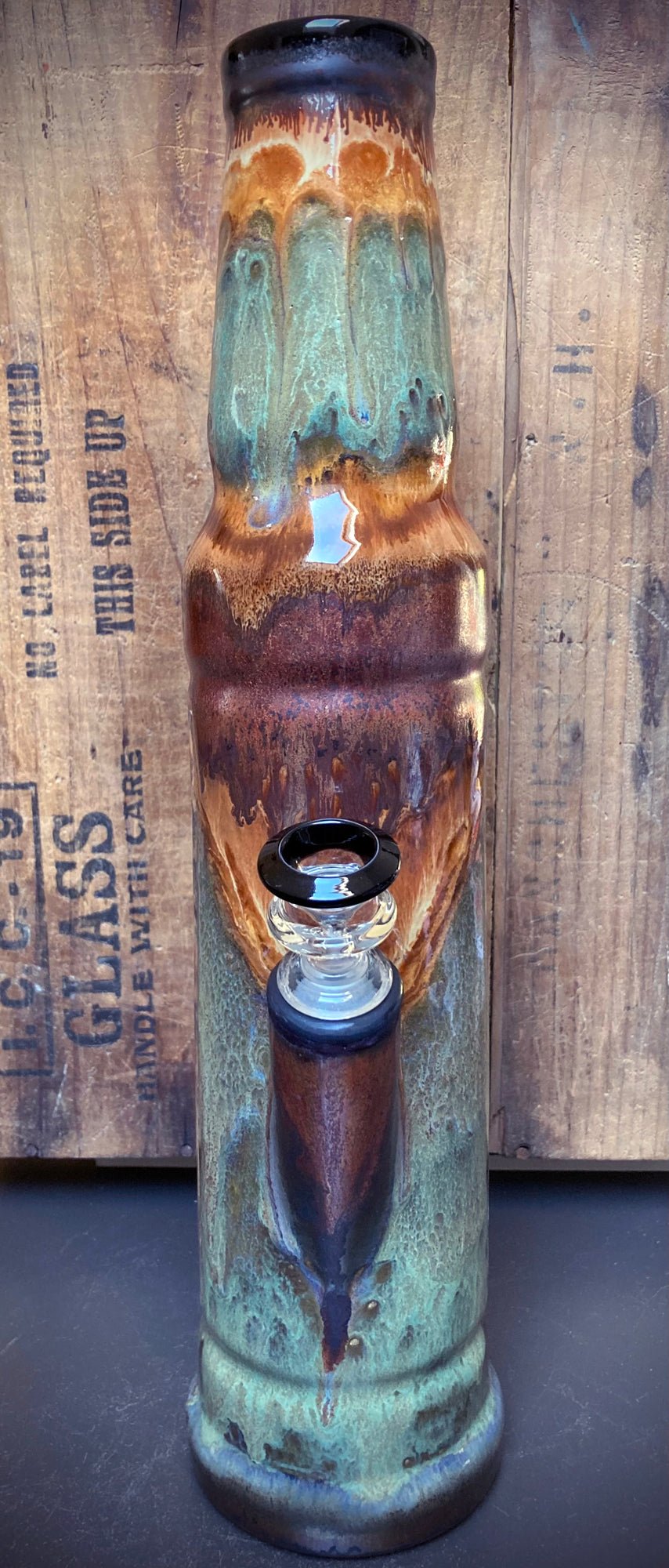 Handcrafted ceramic bong with flowing teal and amber glaze – functional art piece by Berkshire Bong Company