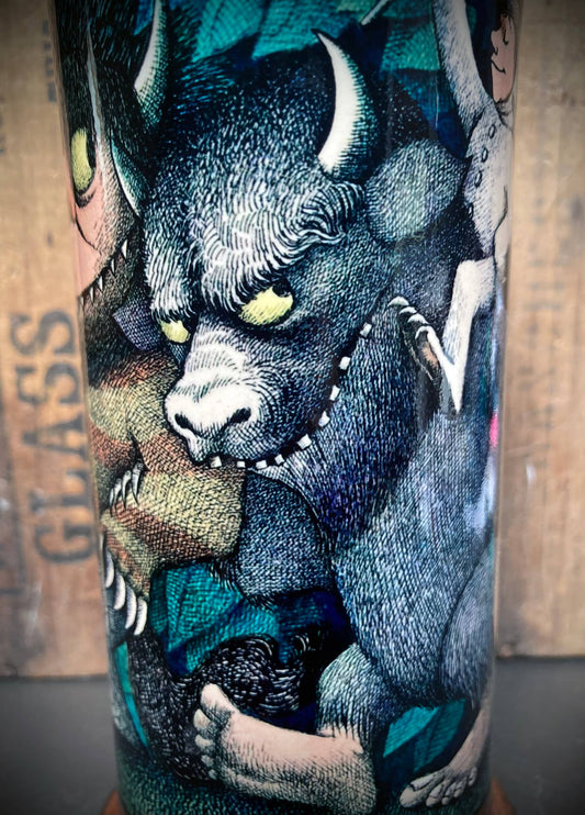 Wild creature illustration with glowing eyes and textured blue-green leaves