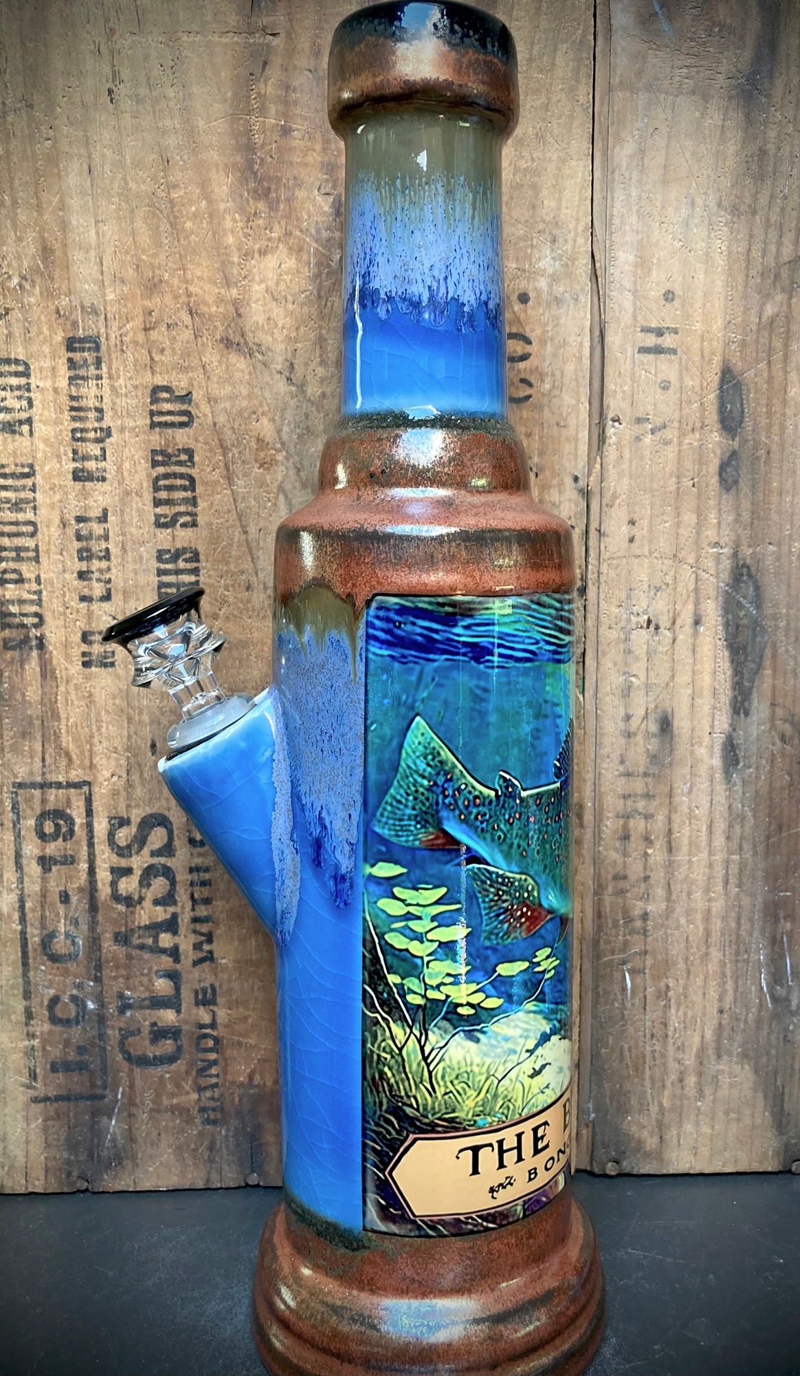 Edgy blue and copper glazed bong with swimming trout design