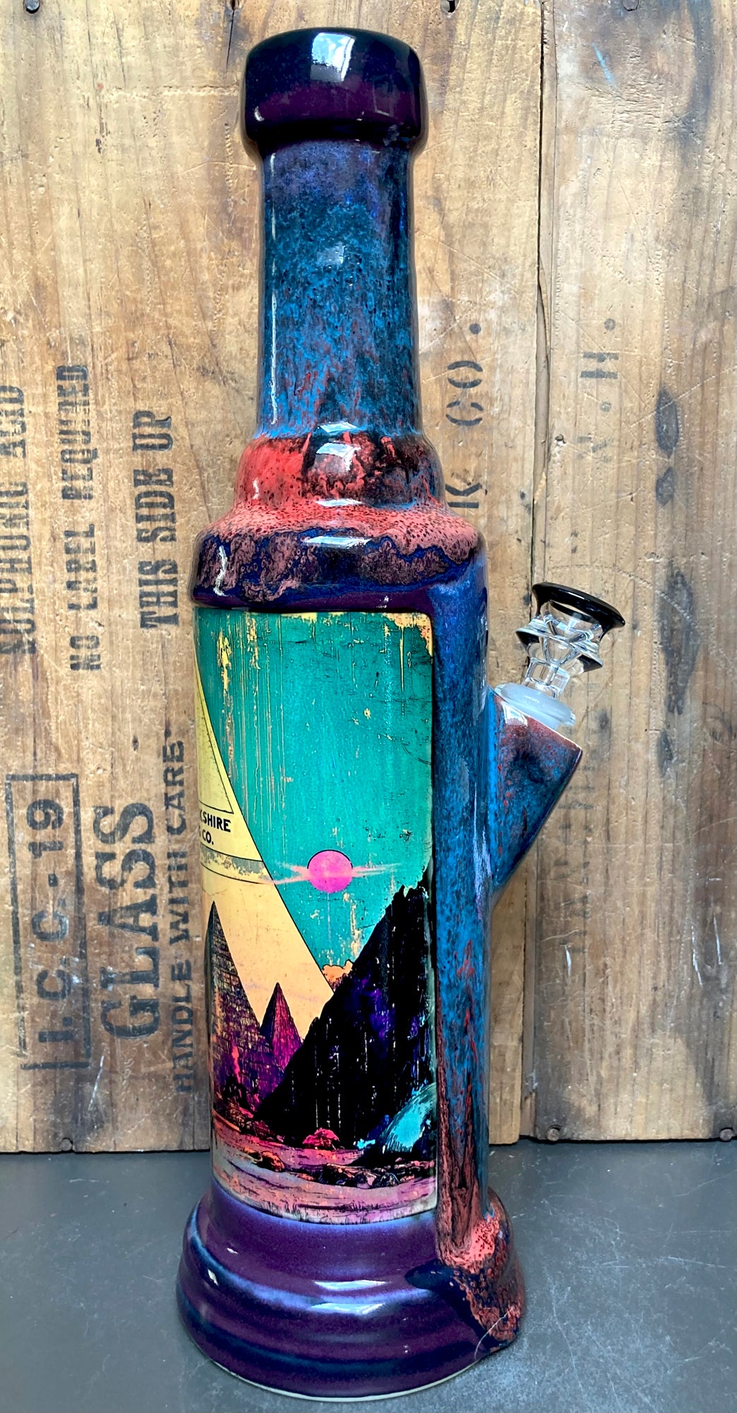 The New Pyramids Ceramic Bong Mystical Energy tall hand glazed ceramic bong with teal purple pyramid scene and clear glass bowl