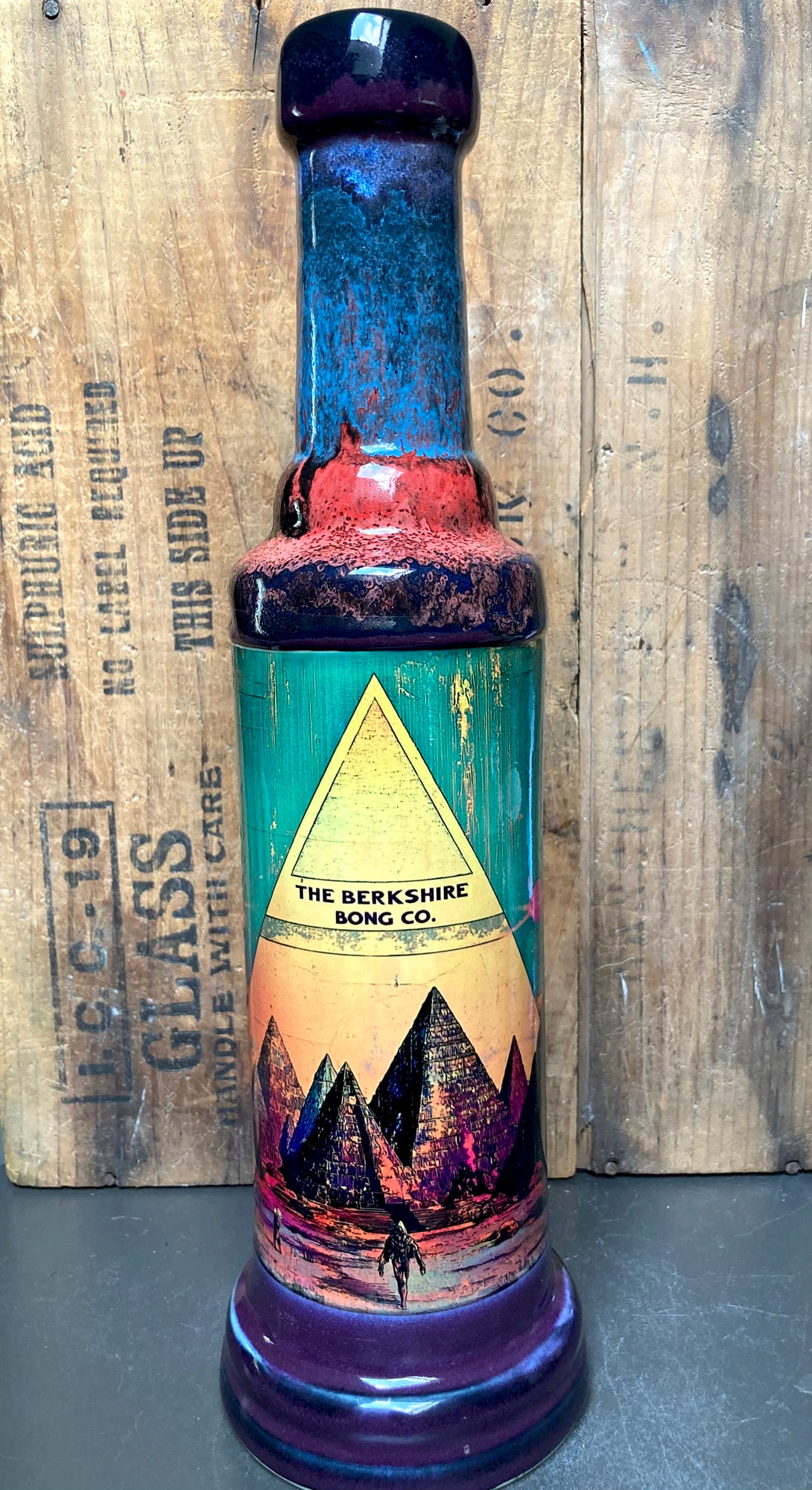 The New Pyramids Ceramic Bong Mystical Energy by Berkshire Bong Company tall teal and purple ceramic bong with pyramid artwork