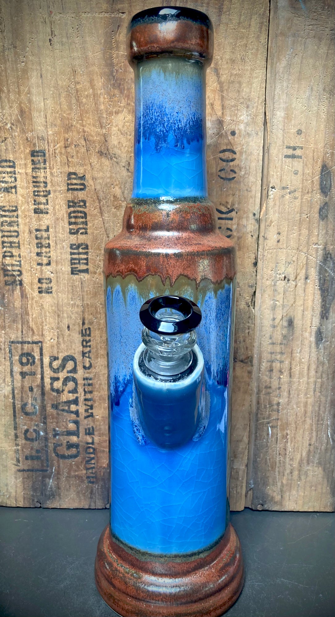 Vintage style ceramic bong with blue sky glaze and imaginative wild things design
