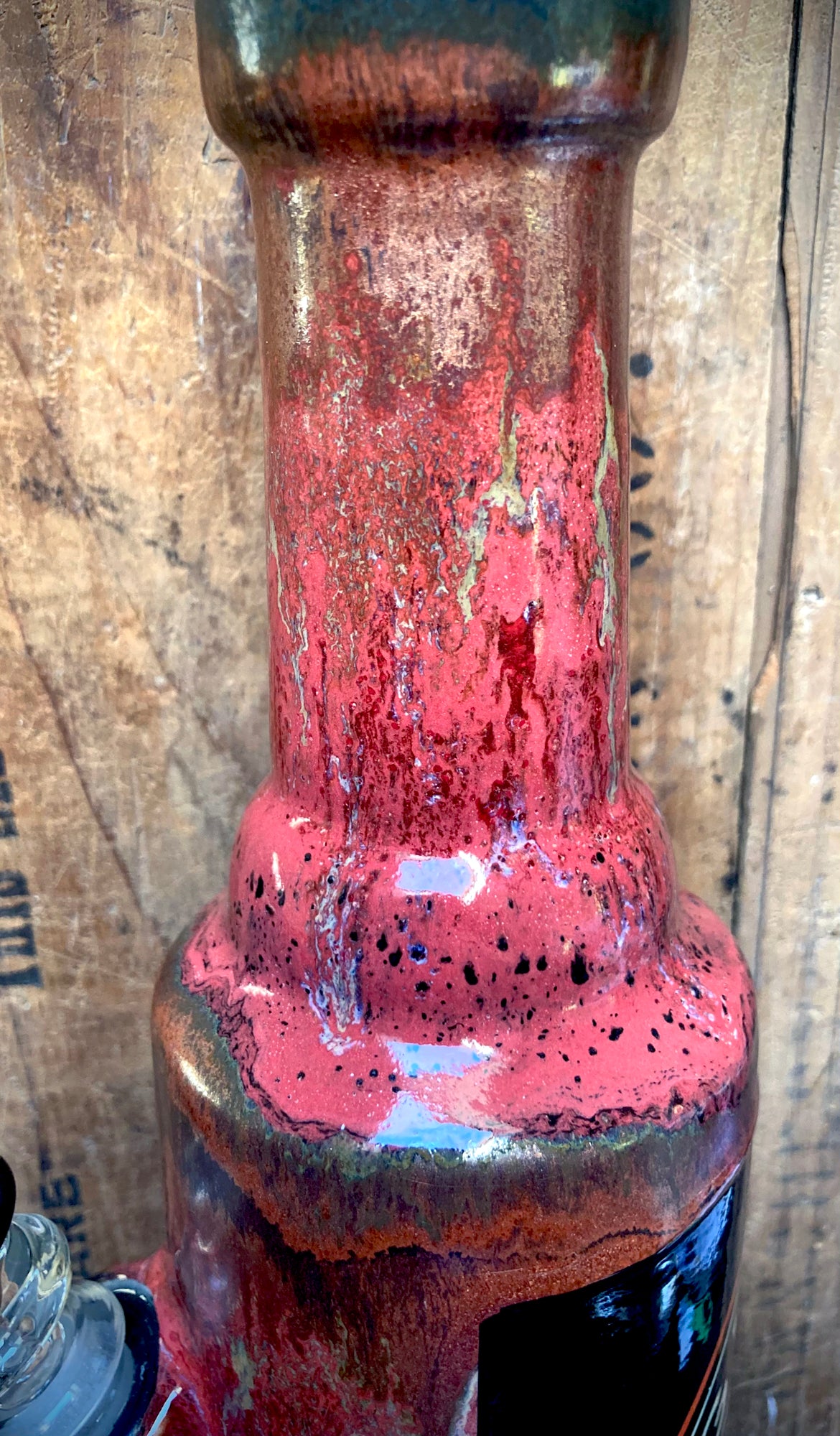 Close-up of a vintage Harley Davidson bong showcasing unique distressed colors and effects