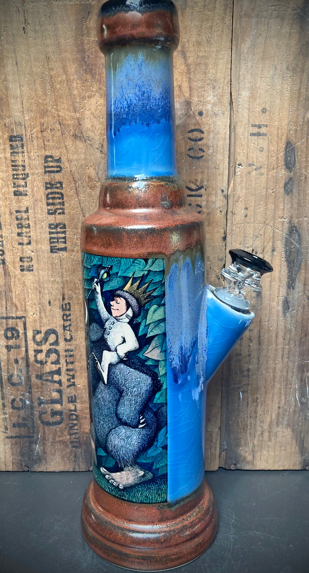 Handmade ceramic bong with blue crackle glaze and wild things illustration