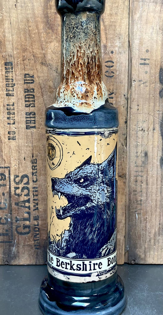 Wolf muzzle and fangs with scratchy linework and parchment glowing yellow backdrop