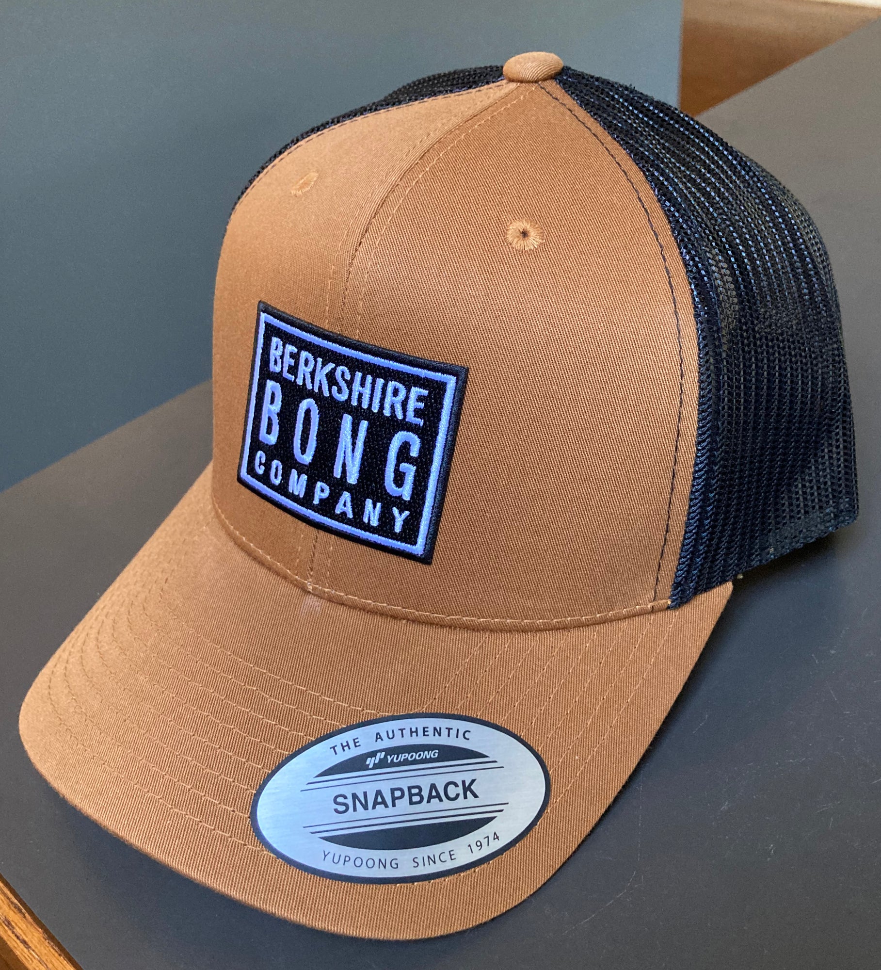 Berkshire Bong Company Trucker Hat in Carhartt Tan with black mesh back and adjustable snapback closure