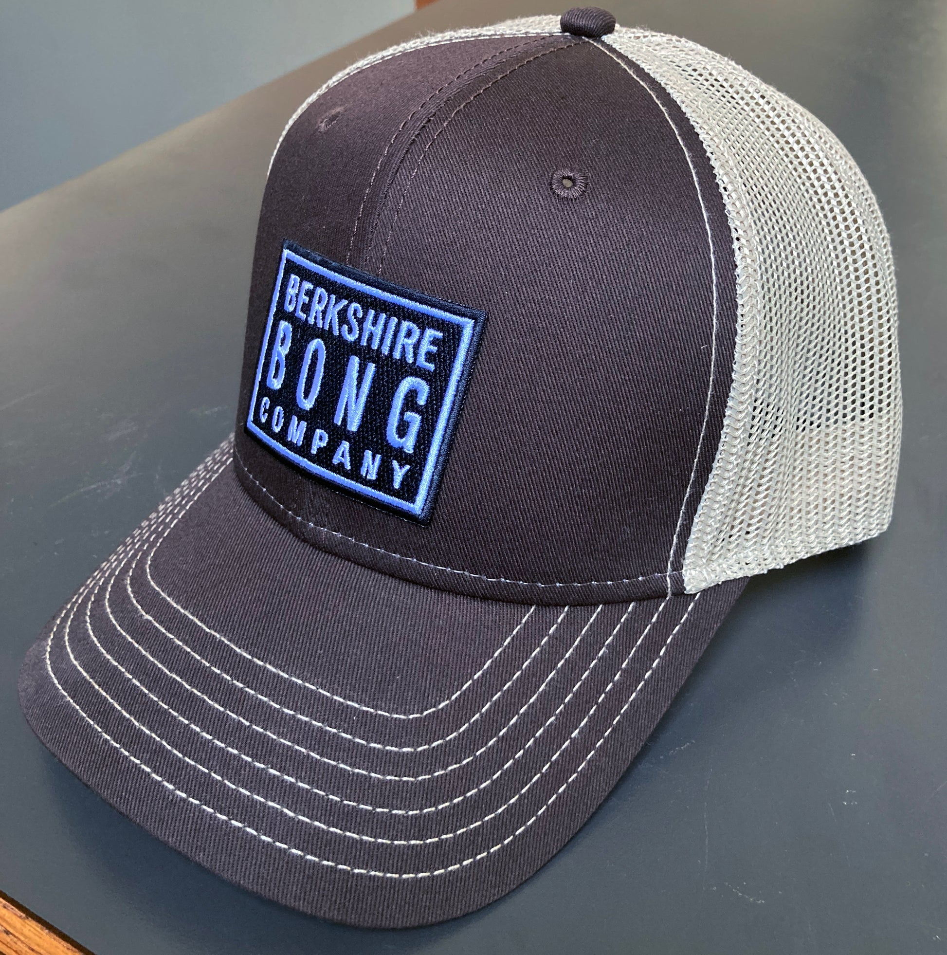 Berkshire Bong Company Trucker Hat in brown and cream with mesh back for casual wear