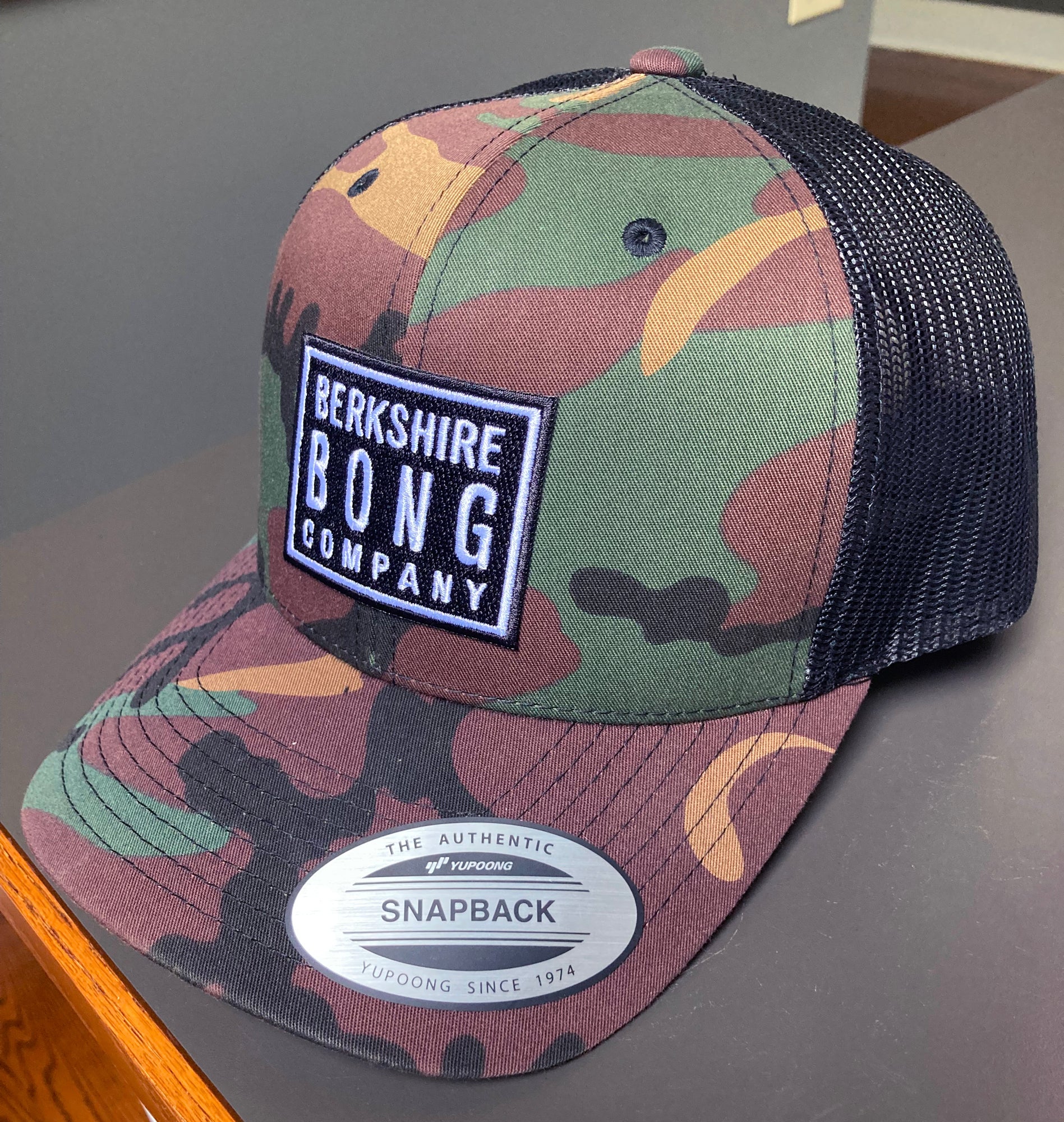 Berkshire Bong Company Trucker Hat in camouflage design with mesh back for outdoor style