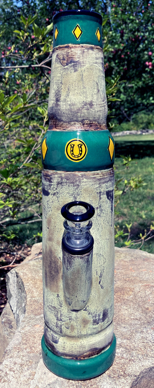 Ceramic bong with deep green matte glaze inspired by forest moss and stone.