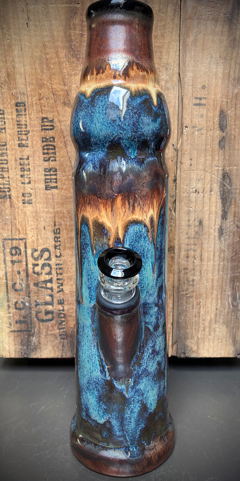 Ceramic bong featuring wise Father Time with a long white beard and earthy glazes.