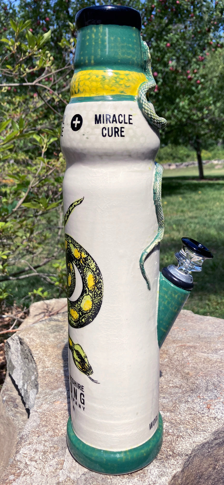 Ceramic snake bong from Berkshire Bong Company featuring a detailed snake design and vibrant colors