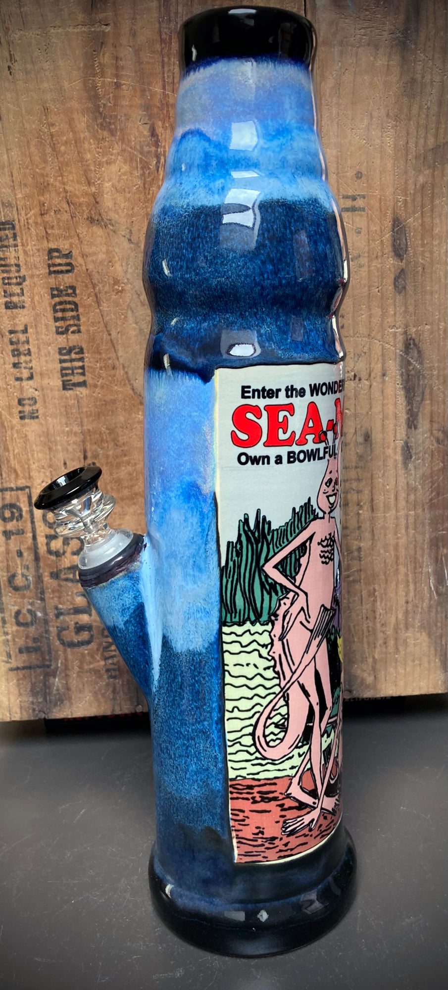 Ceramic bong with playful comix art and Sea Monkeys in ocean blue glazes.