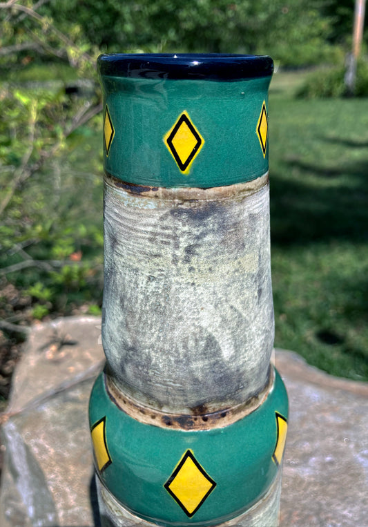 Handcrafted bong featuring earthy green tones and textured mossy glaze.
