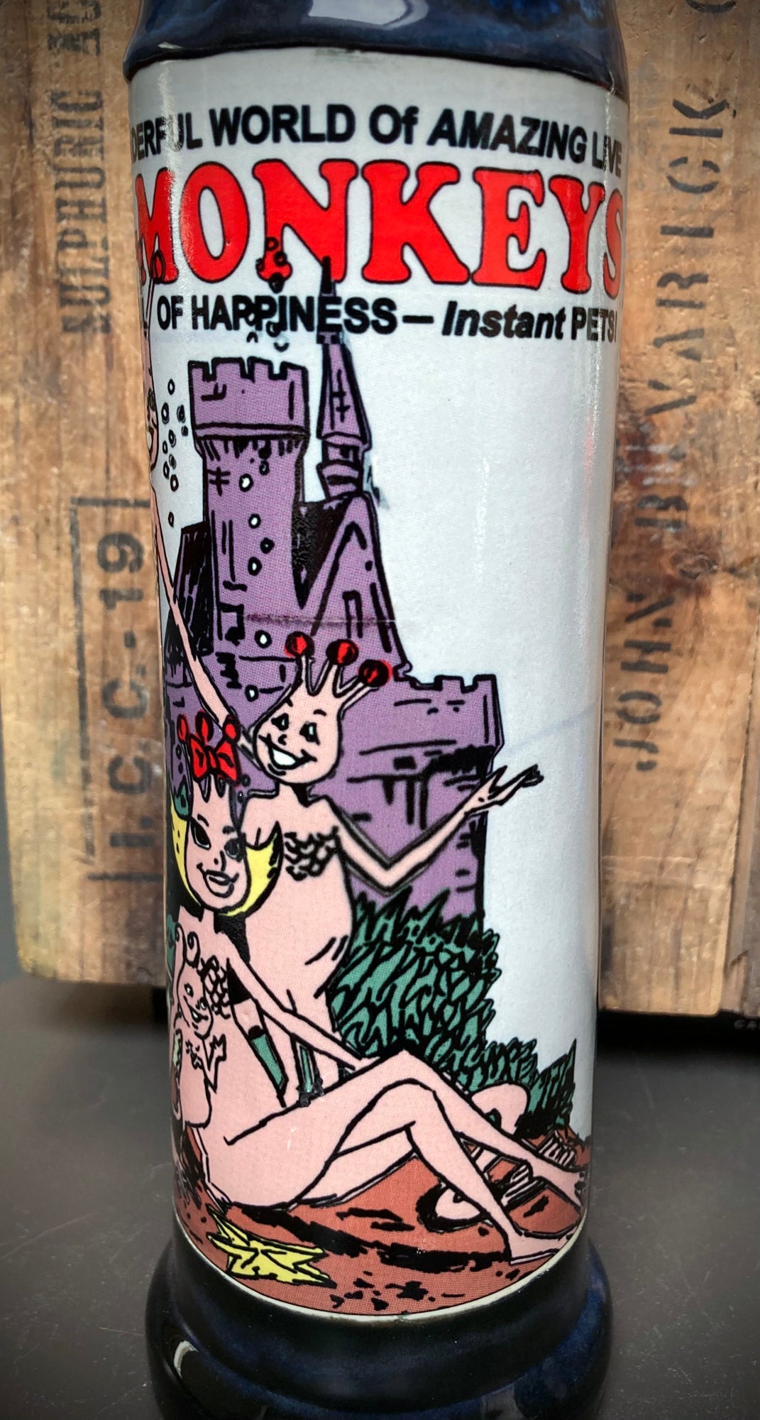 Sea Monkey comic book design on ceramic bong with dark and light blue glazes.