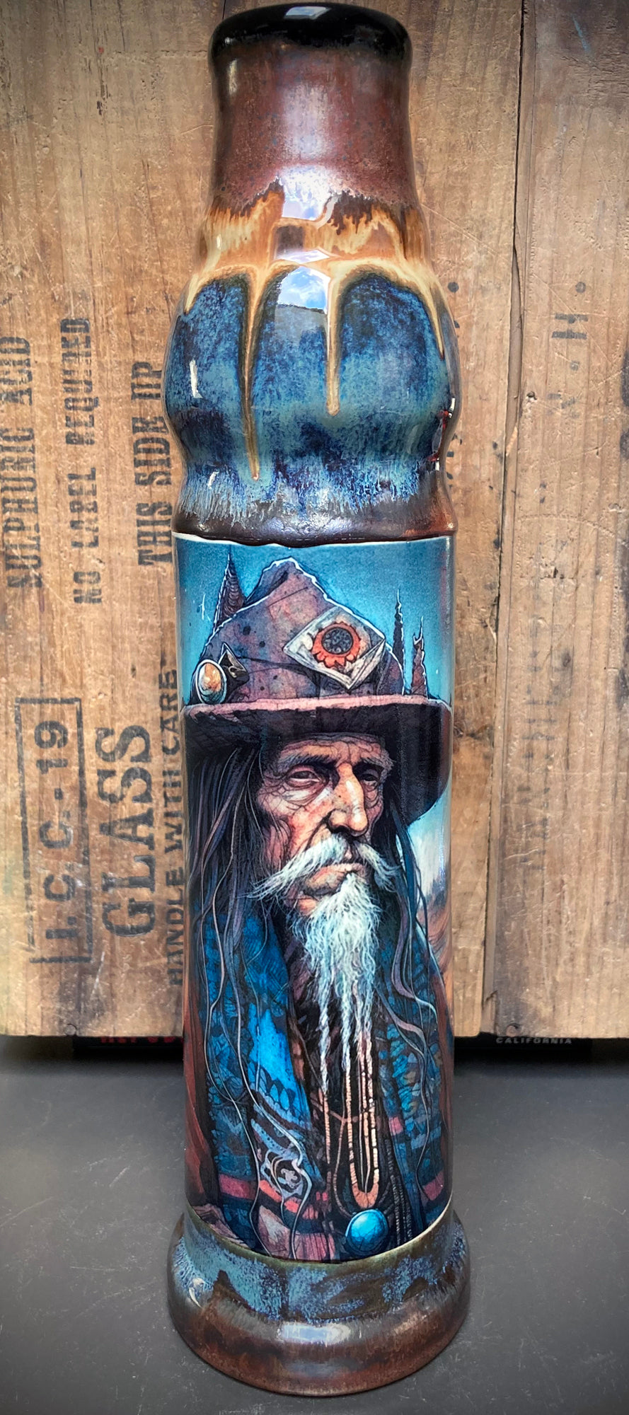 Bong featuring Father Time in wide hat with rich, earthy glaze palette.