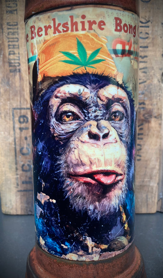 handcrafted ceramic bong with orange glaze and cheeky chimp design
