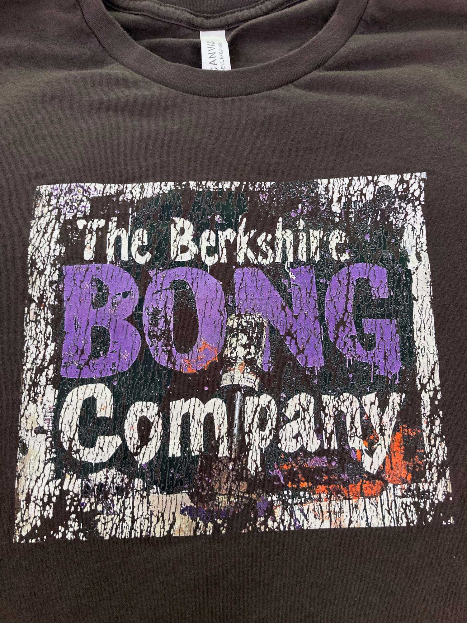 Distressed Graffiti Logo T-Shirt Vintage Street Art Style Tee in Dark Brown. Featuring Berkshire Bong Company cracked purple logo