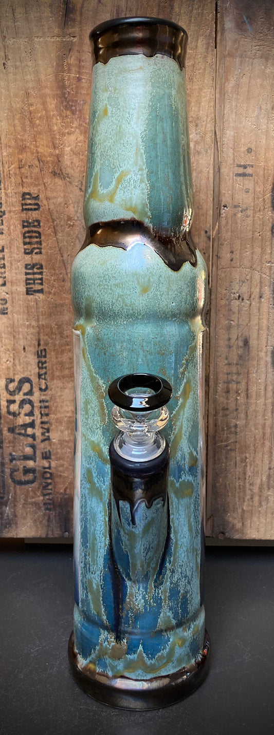 Ceramic bong showing River Queen with earthy green and golden hues.